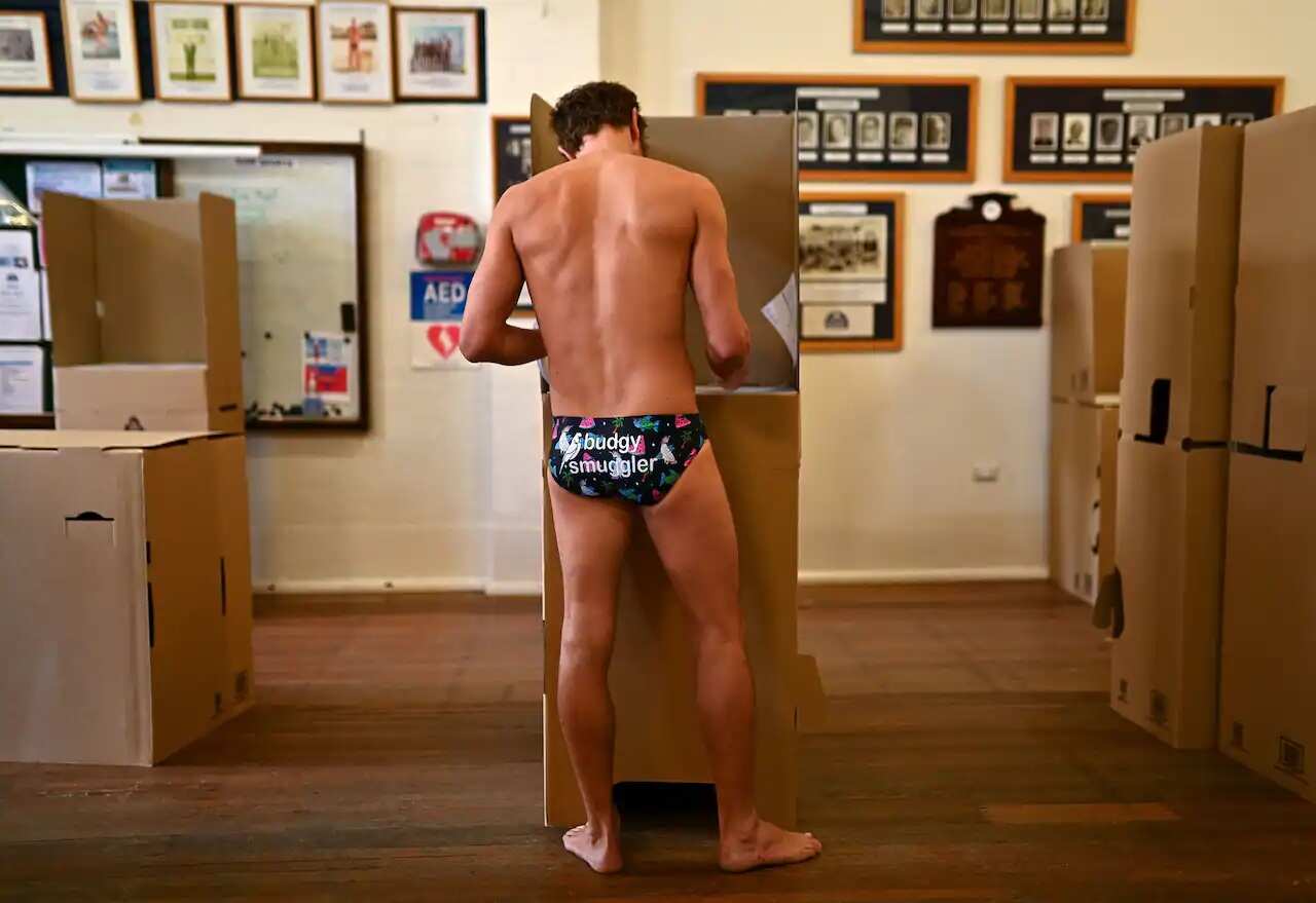 A man casts his vote at a polling station at Bondi Beach in Sydney.