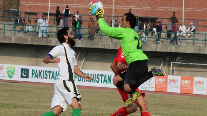 Football players in action