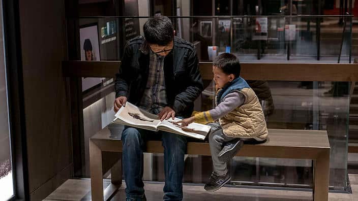 A father and son read picture book in the Suzhou Eslite
