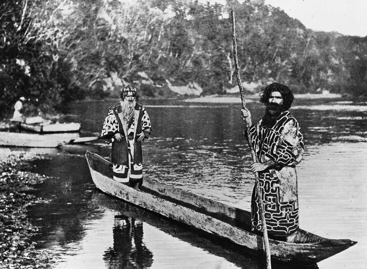 Two Ainu men in dugout canoe.  Undated photograph.