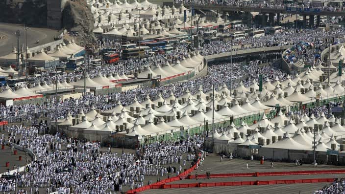 Muslim pilgrims leave their tent throngs in Mina near the holy city of Mecca, Saudi Arabia 19 December 2007. (Photo: ROSLAN RAHMAN/AFP/Getty Images)