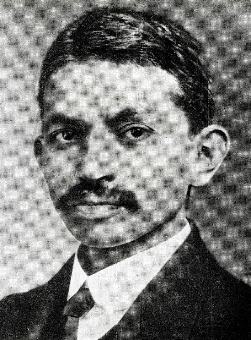 A head and shoulders shot of Indian spiritual leader Mahatma Gandhi, wearing European clothes.