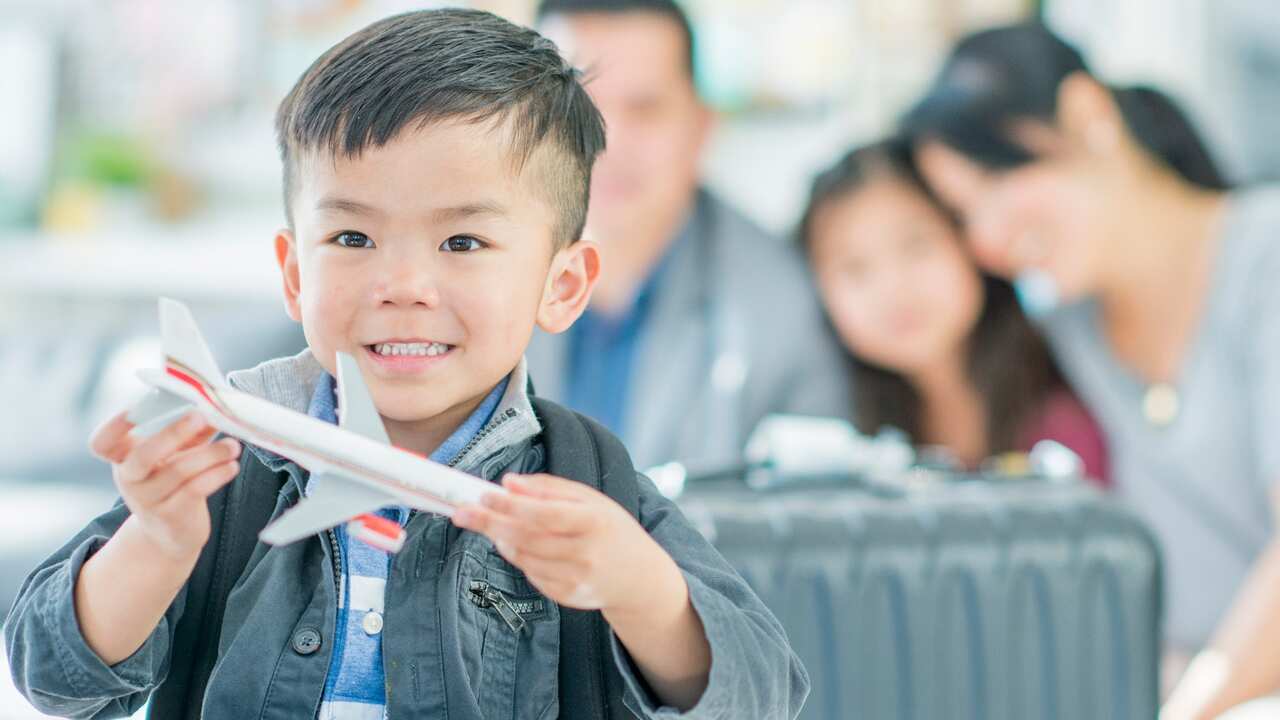 A boy with a toy plane