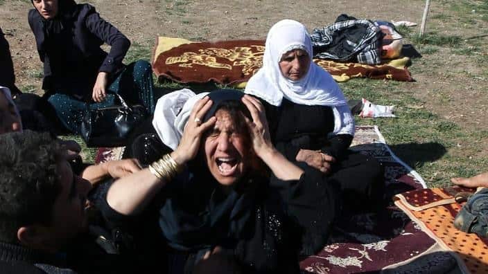 Earthquake survivors who had lost their relatives cry at Sarpol-e Zahab province of Kermanshah, Iran