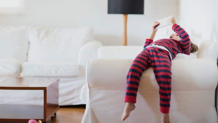 2 year old boy using a digital tablet