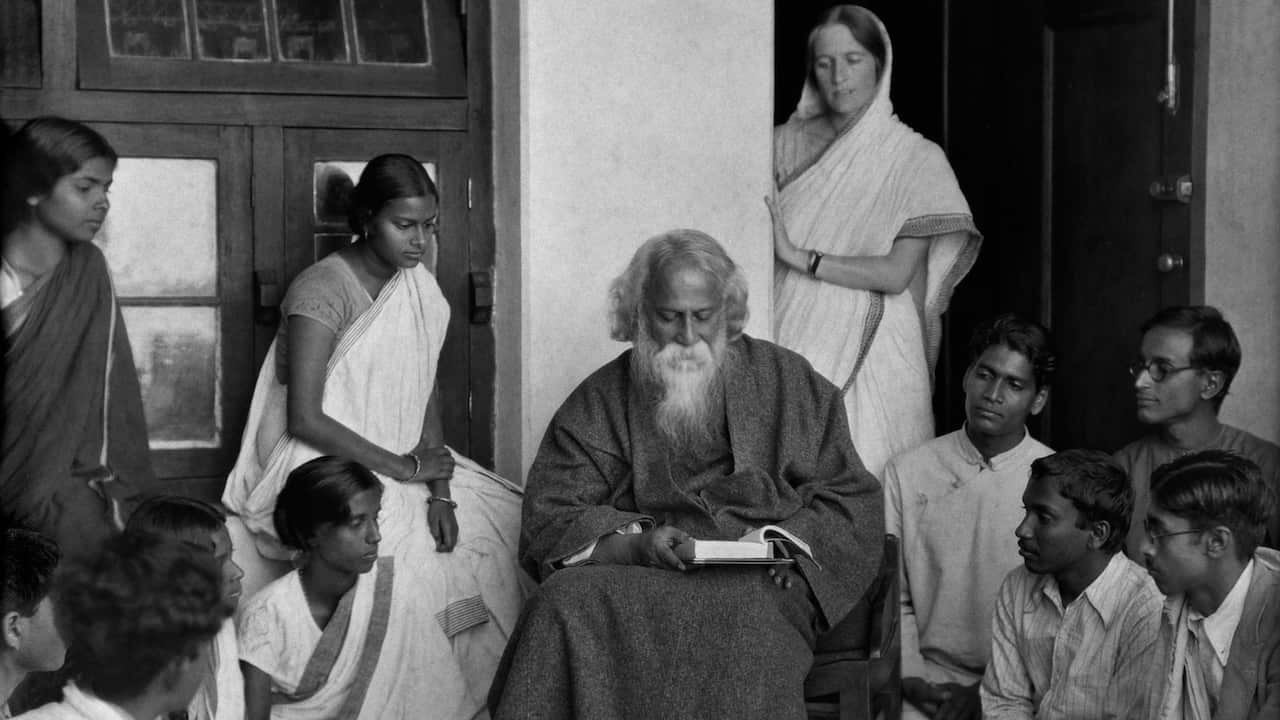 Students surround writer Rabindranath Tagore (1861 - 1941) at his university, Visva Bharati, in Santineketan, West Bengal, India, 1929.