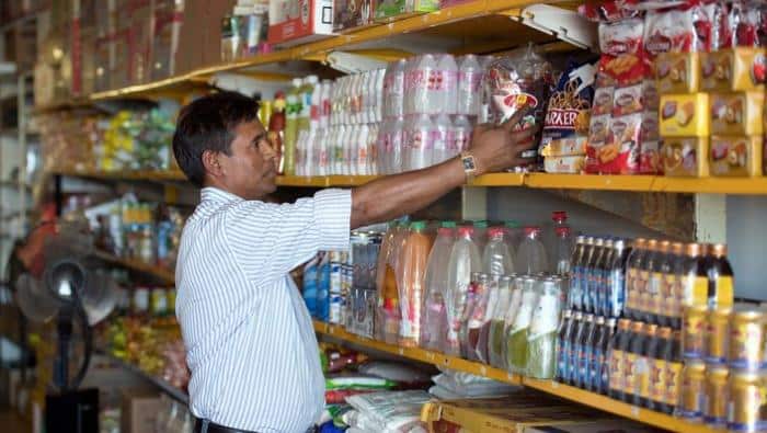 Rohingya refugee Kobir Ahmed working inside a grocery store