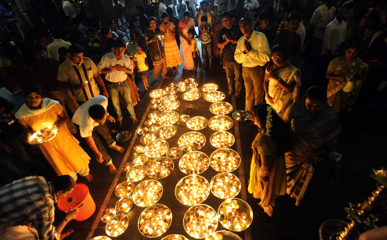 Sri Lankan women devotees offer prayers