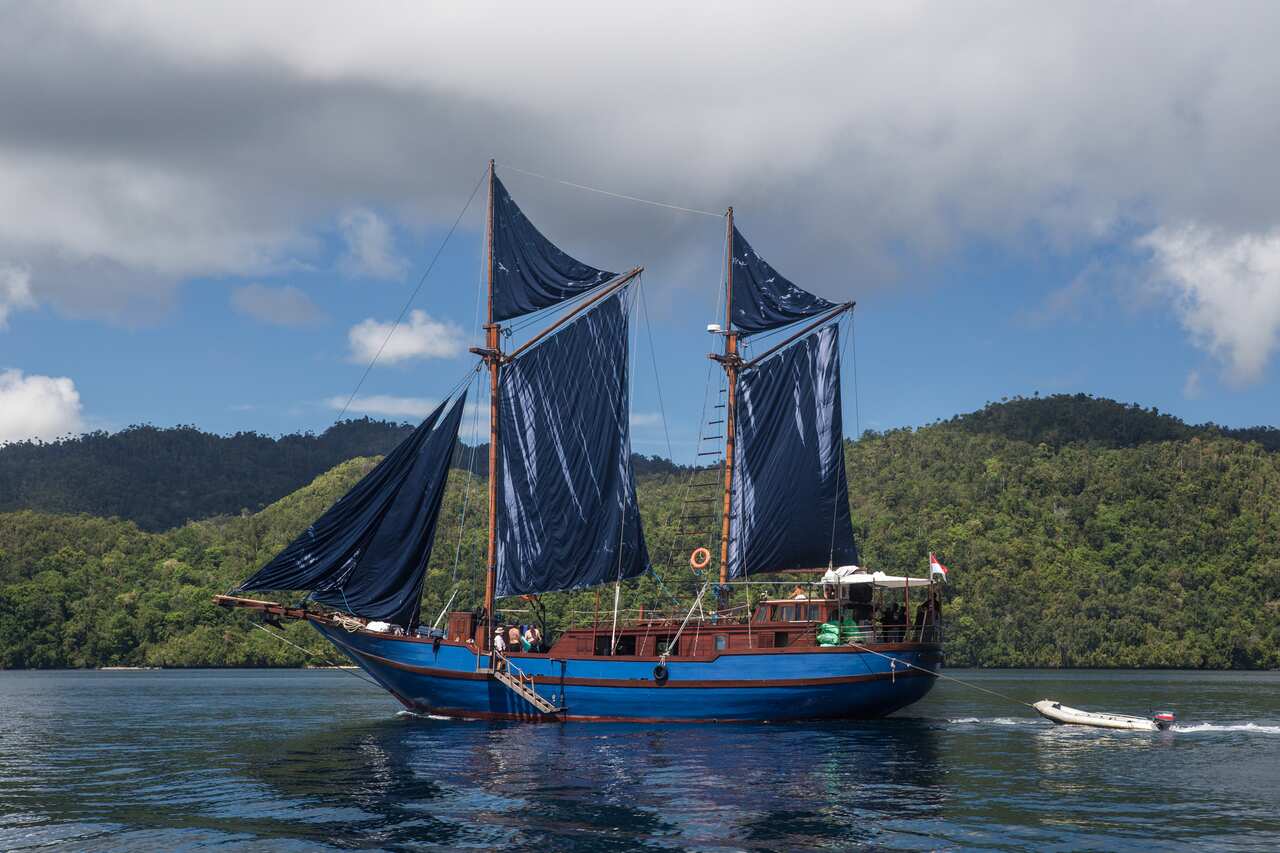 Pinisi Schooner With Sails Up in Raja Ampat