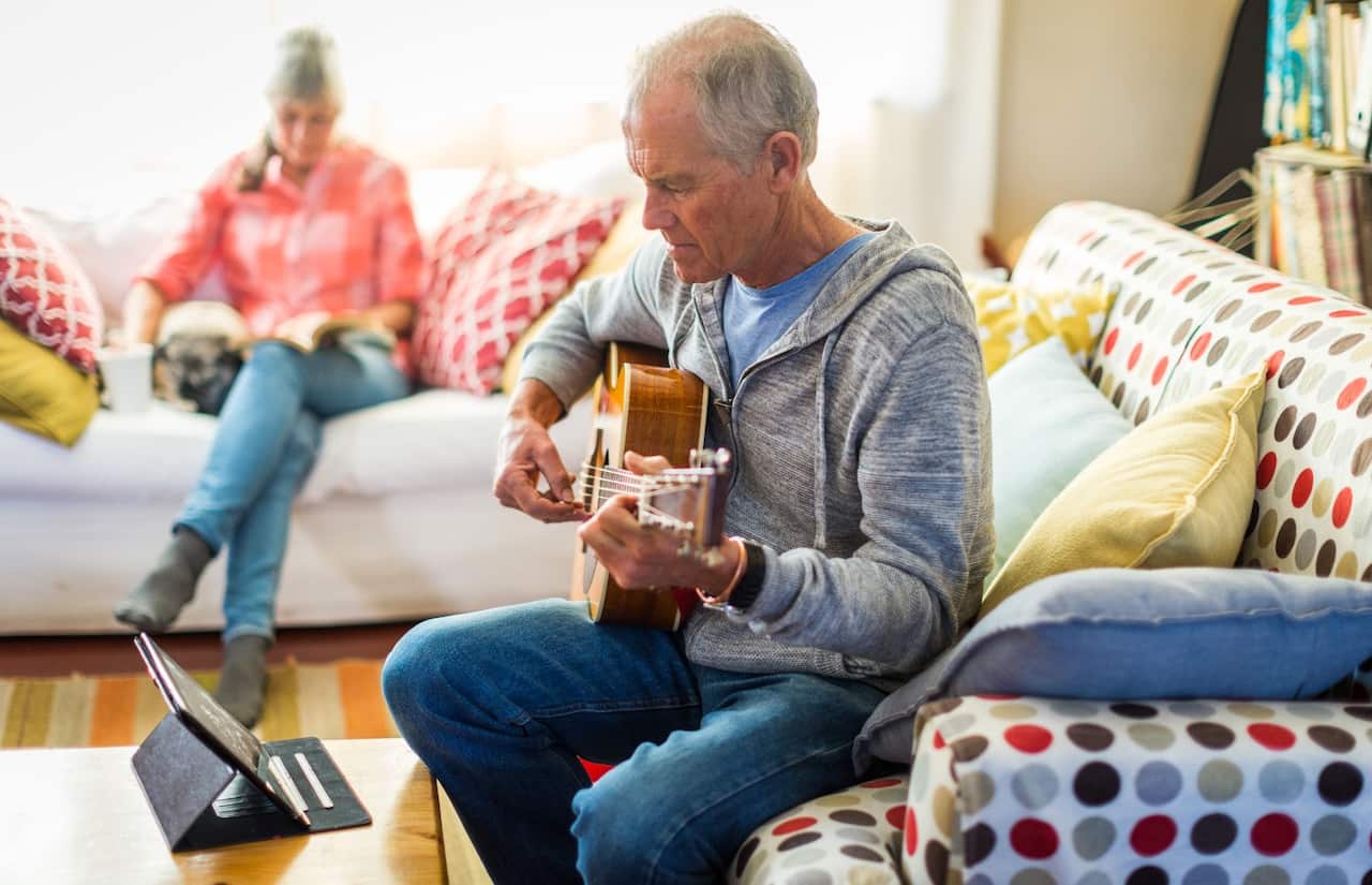 Man learning guitar