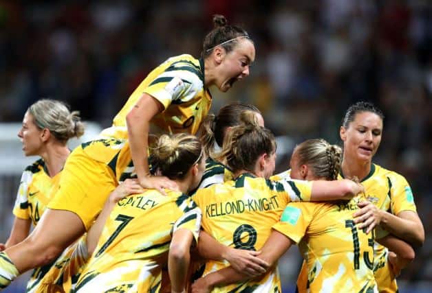Elise Kellond-Knight of Australia celebrates with teammates after scoring her team's first goal during the 2019 FIFA Women's World Cup France Round Of 16