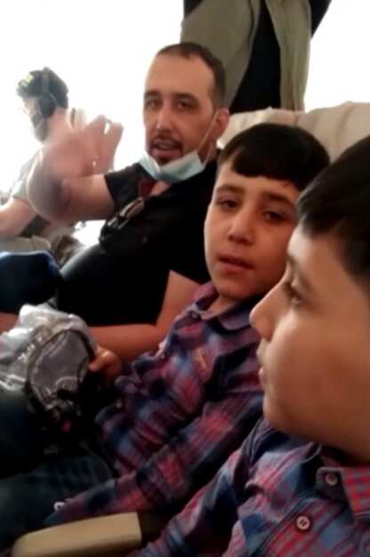Mr Zadah and his children aboard their evacuation flight.