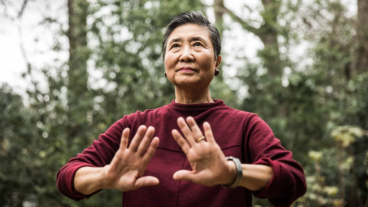 Senior woman doing Tai Chi outdoors