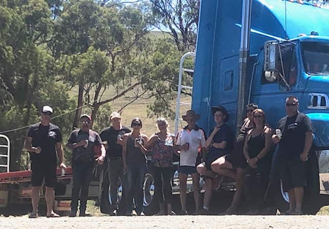 Group of volunteer truck drivers and locals at the donations drive in Ensay 
