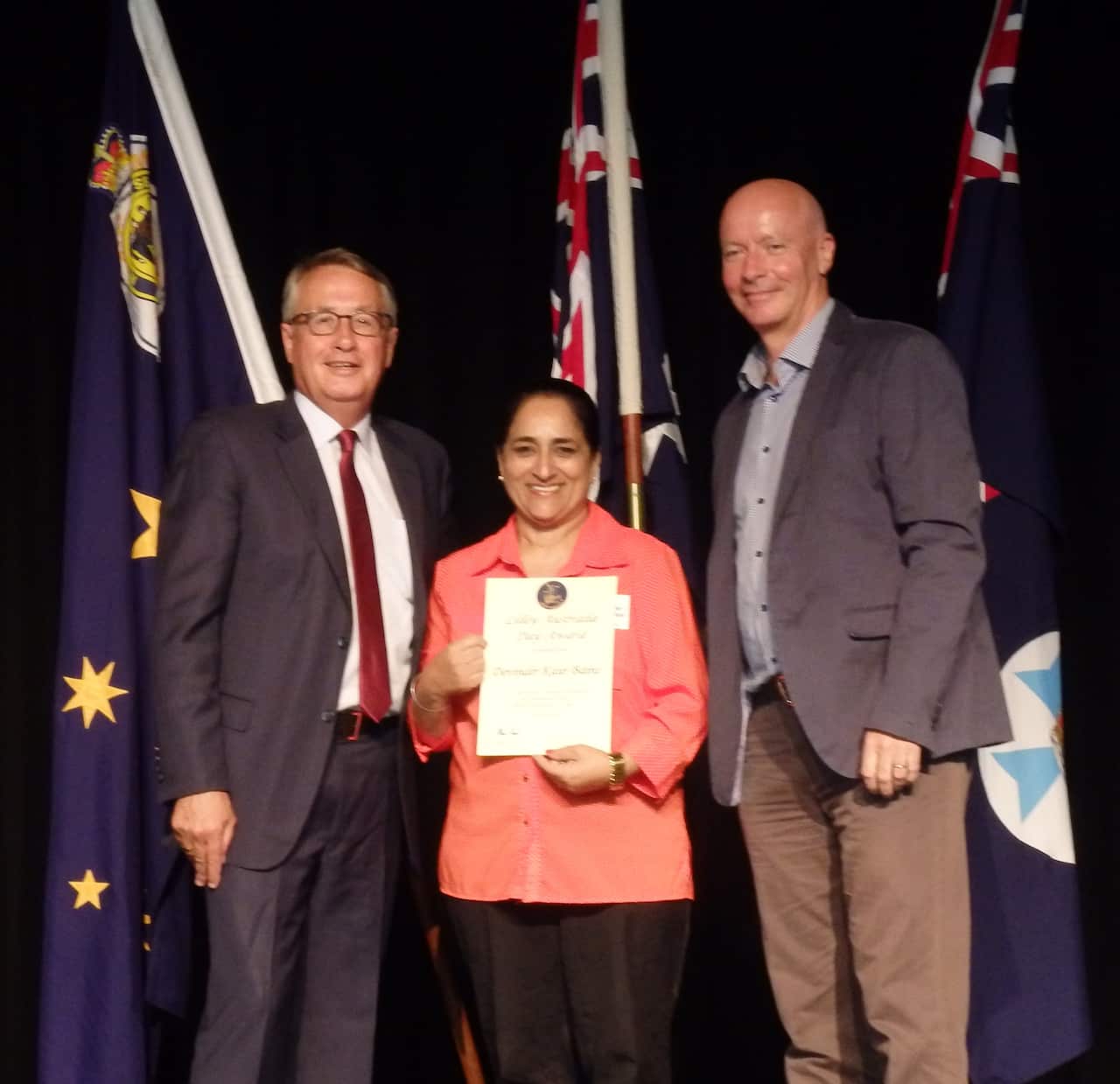 Devinder Kaur Bains receiving the Lilley Award from former Depute PM Wayne Swan