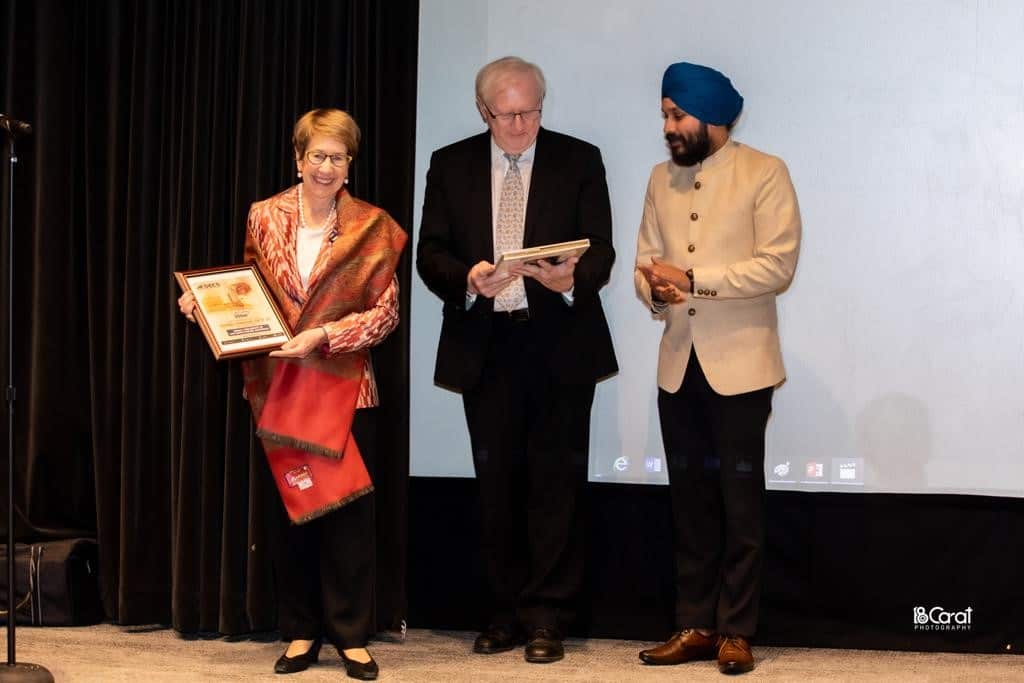 NSW Governor Margaret Beazley, husband Dennis Wilson and Gurnam Singh, founder of AISECS