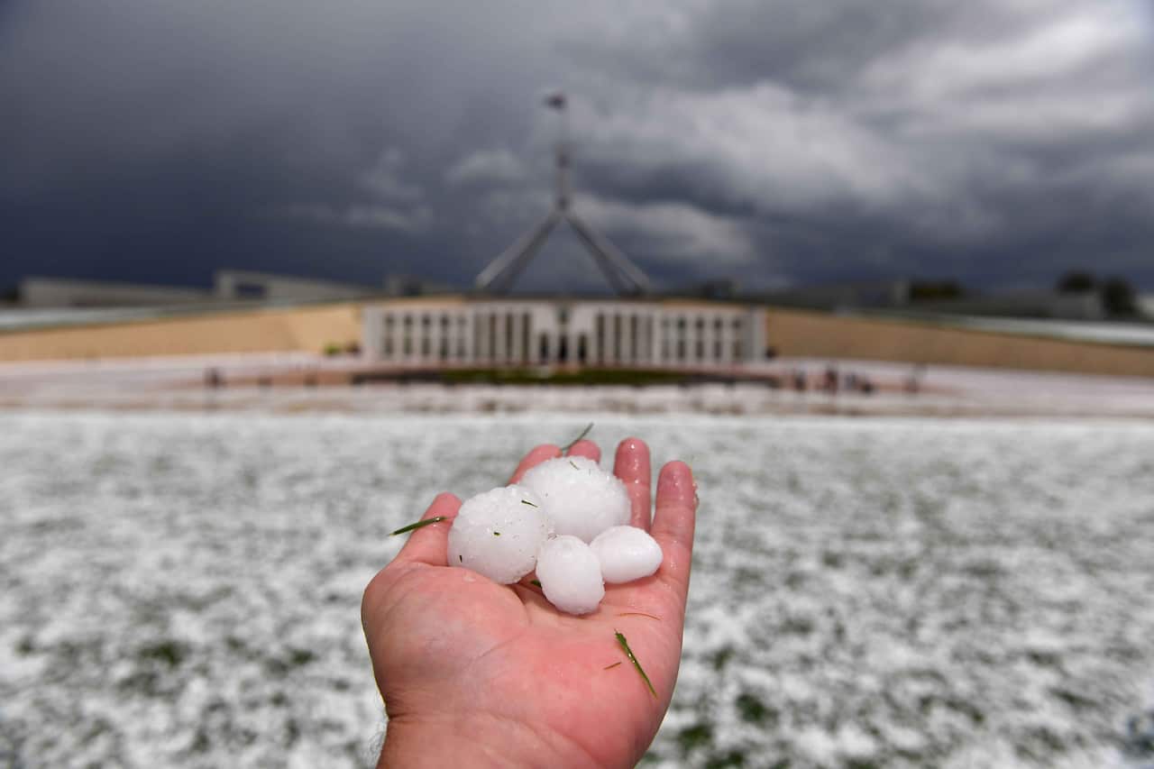 Golf ball size hail after a severe hail storm is seen at Parliament House in Canberra, Monday, January 20, 2020. (AAP Image/Mick Tsikas) NO ARCHIVING