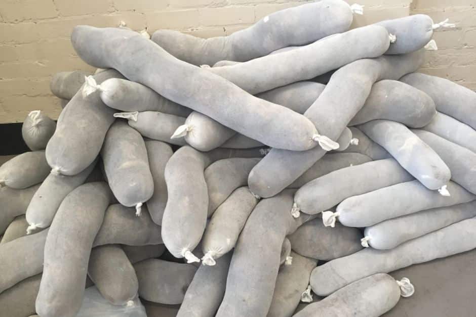 A pile of stockings stuffed with human hair used t clean up oil spills.