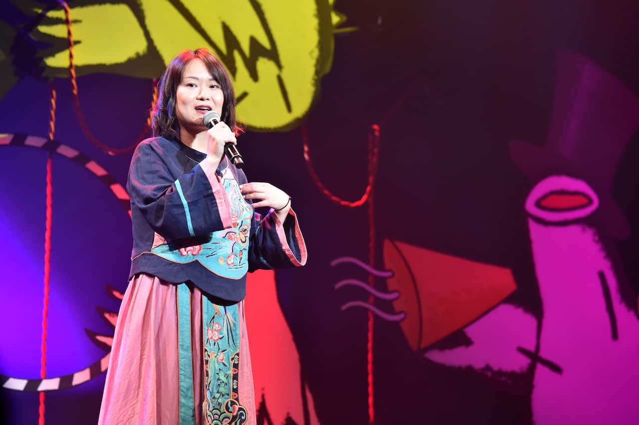 Huang He performing at the Melbourne International Comedy Festival. 