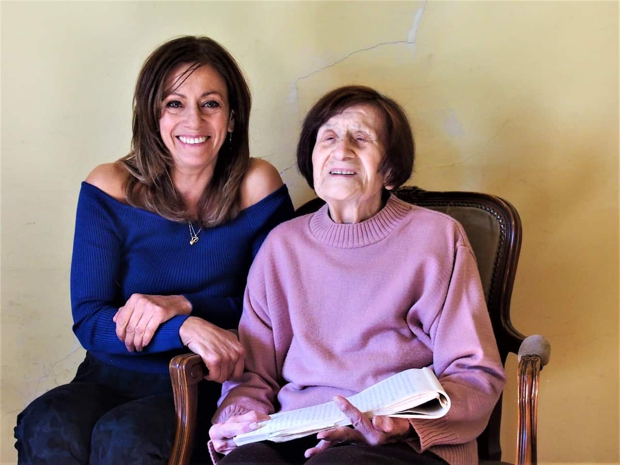 Helena Kidd and her mother, Maria Avraam holding her original diary. 