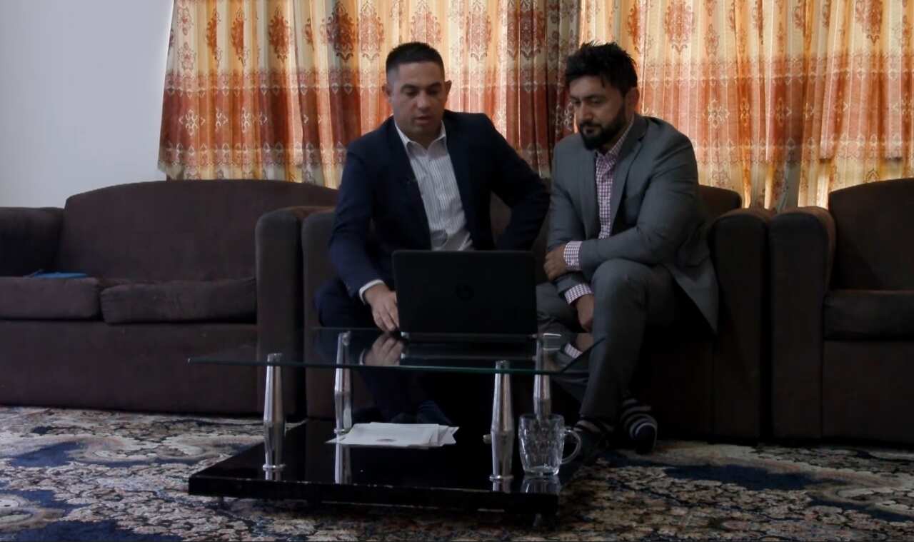 Mr Mamond sitting with SBS Pashto reporter Abdullah Alikhil.