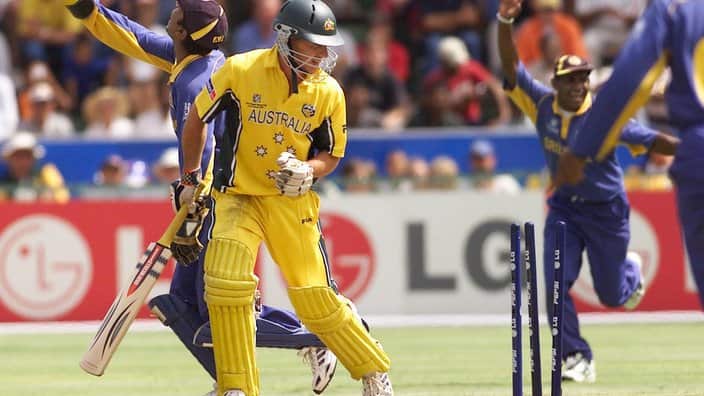 Australian batsman Brad Hogg looks at his broken wickets  after he was stumped by Sri Lankan wicket keeper Sangakkara during a semi-final cricket World Cup tournament in Port Elizabeth, South Africa, Tuesday March, 18, 2003. (AP Photo/Obed Zilwa)