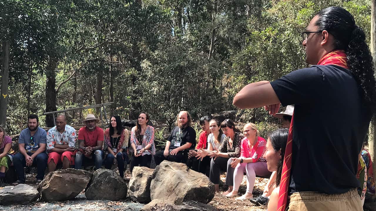 Practitioners of Ho'oponopono sitting in a circle