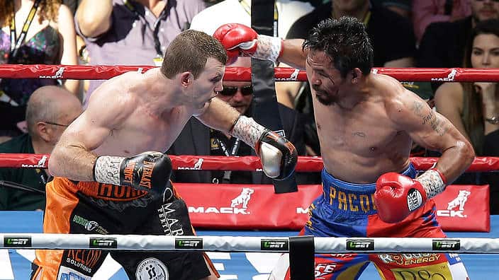 Jeff Horn, left, of Australia and Manny Pacquiao of the Philippines fight during their WBO World welterweight title bout in Brisbane, July 2, 2017.