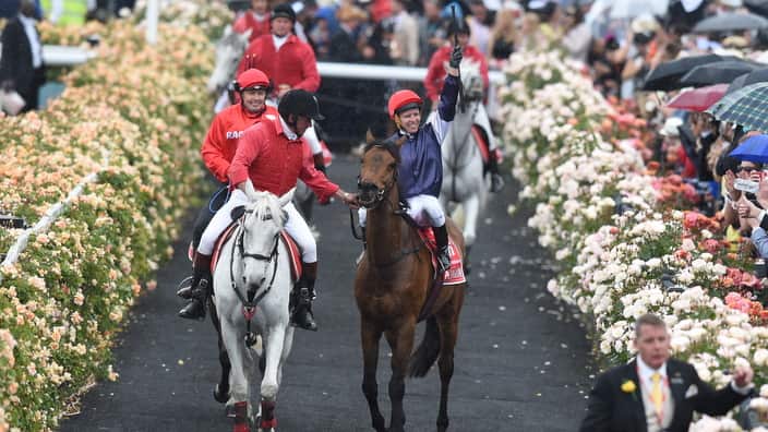 Jockey Kerrin McEvoy celebrates on Almandin returning to scale after winning the Melbourne Cup at Flemington Racecourse in Melbourne, on Tuesday, Nov. 1, 2016. (AAP Image/Dan Himbrechts) NO ARCHIVING, EDITORIAL USE ONLY