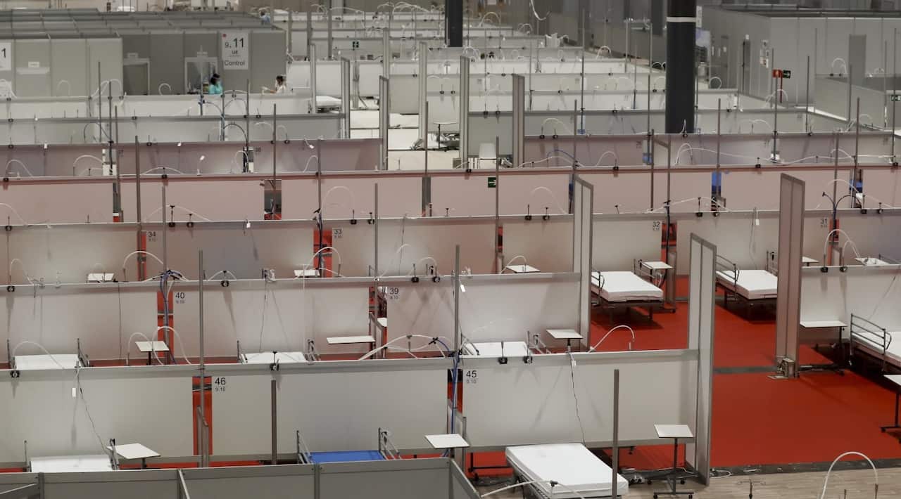 General view of several empty beds at field hospital for COVID-19 patients set up at Ifema exhibition and convention center in Madrid.