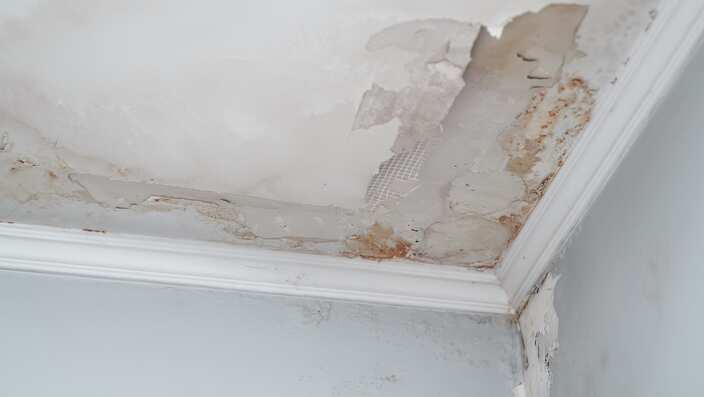 Closeup on the water damaged ceiling