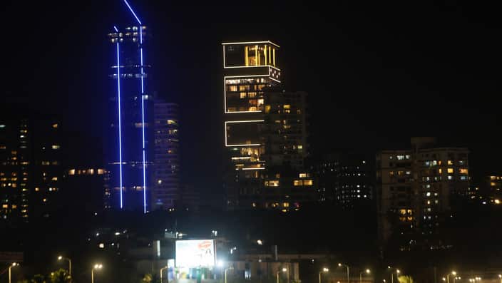 The house of Reliance Industries Chairman Mukesh Ambani is seen illuminated, center, ahead of the wedding of his daughter Isha, in Mumbai, India.
