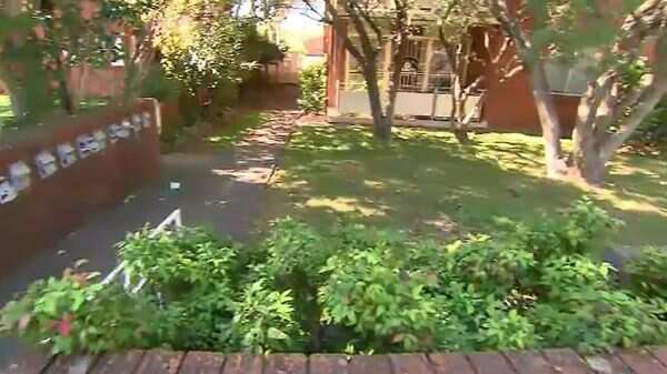 The woman ran into a front yard in Ashfield last night when a man placed a cable bike lock around her neck.