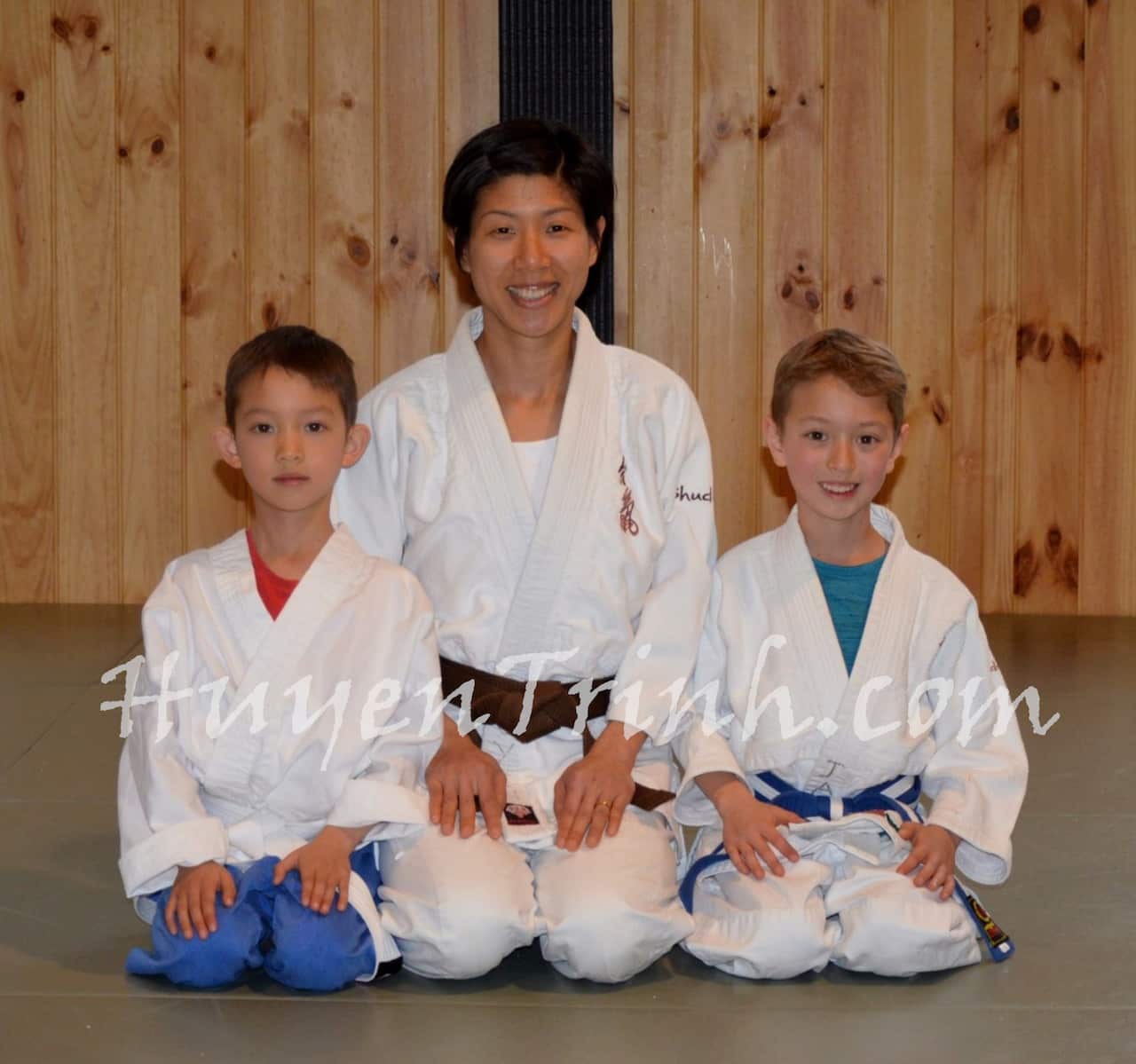 Huyen, Jayden and Liam in a martial arts class