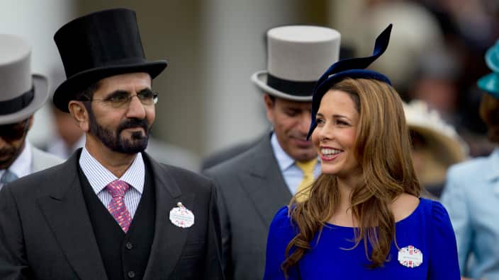 Sheikh Mohammed Al Maktoum and his wife Princess Haya of Jordan walk towards the paddock on the second day of Royal Ascot horse race meeting at Ascot, England. 