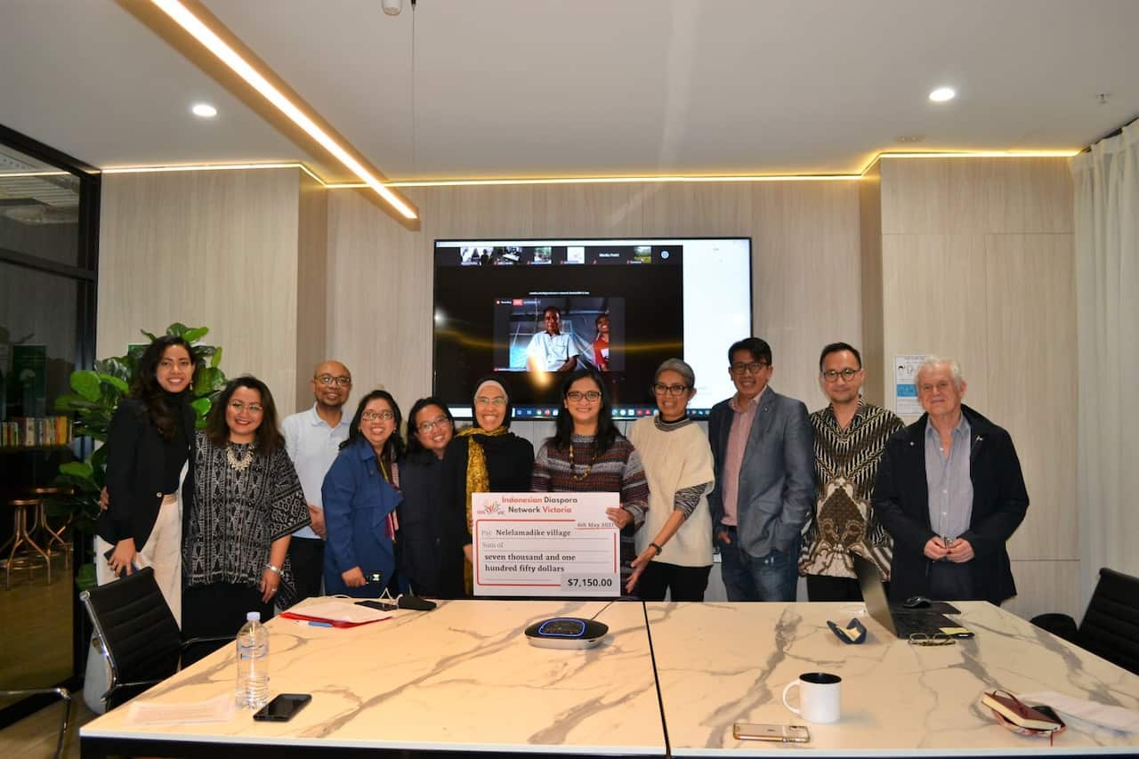 IDN representatives handing over emergency aid after the Seroja cyclone.