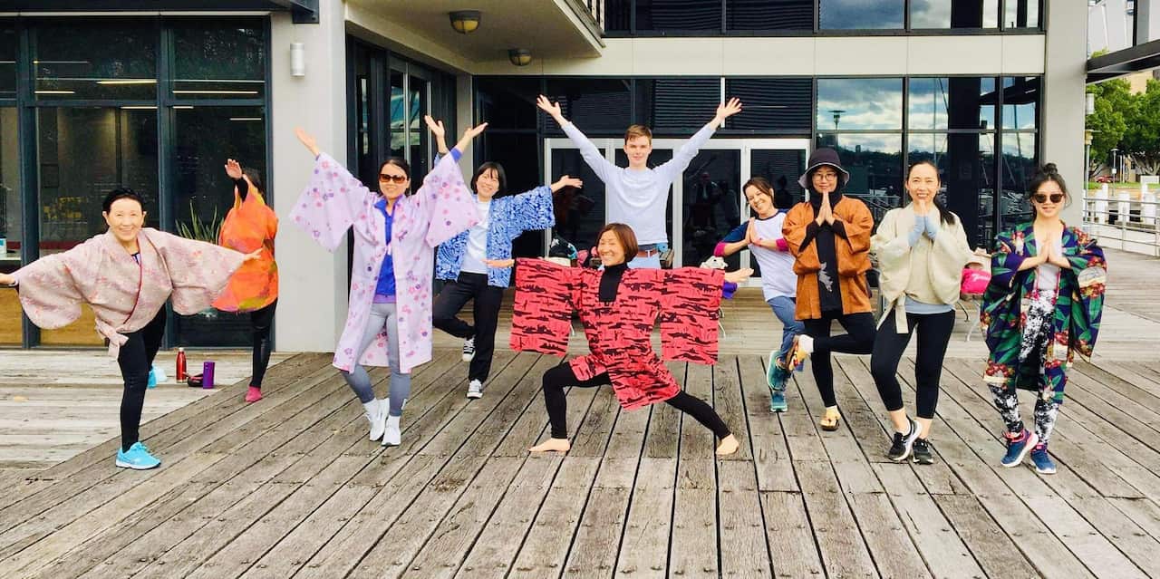 Members of the International Kimono Club Sydney enjoys their "Kimono de Yoga" event, doing yoga with wearing kimono jacket.