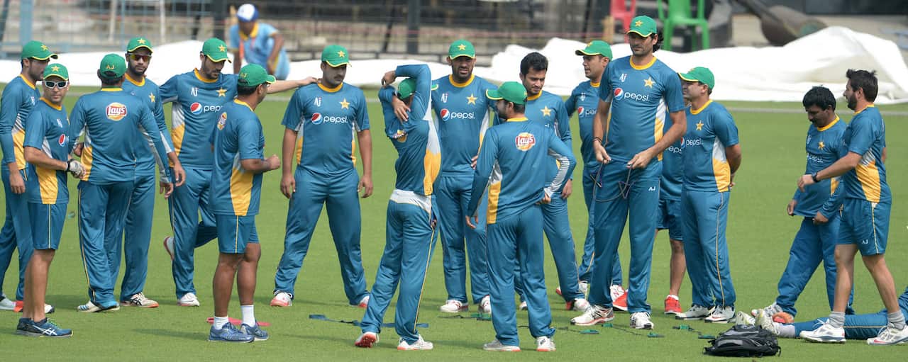 Pakistan's captain Shahid Afridi(R) walks with teammates during a training session at The Eden Gardens Cricket Stadium in Kolkata on March 13, 2016, ahead of the World T20 cricket tournament