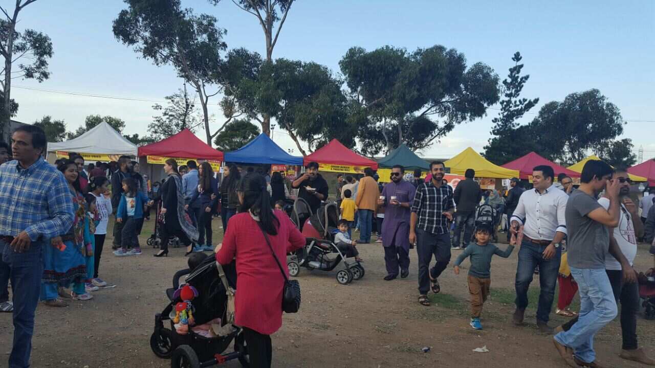 People enjoying food at the Basant festival