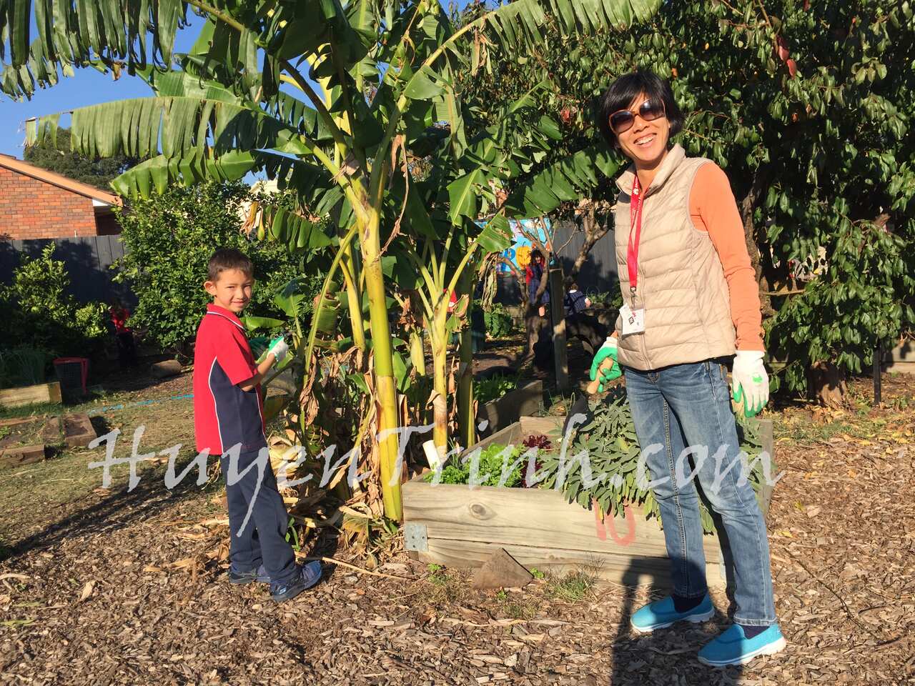 Mom and son gardening together