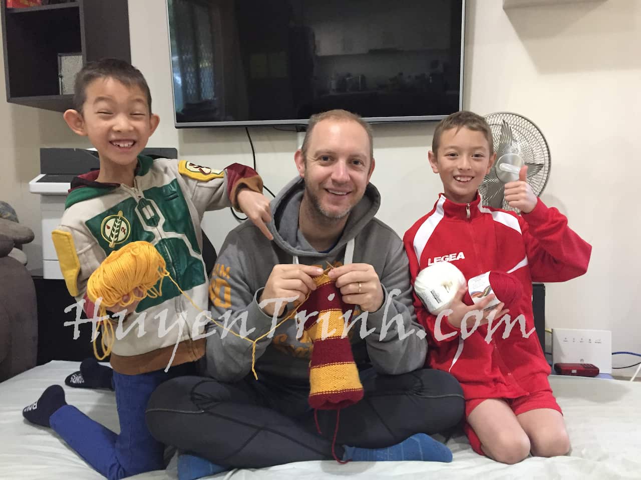 Calum is learning how to knit a Harry Porter's scarf for his son