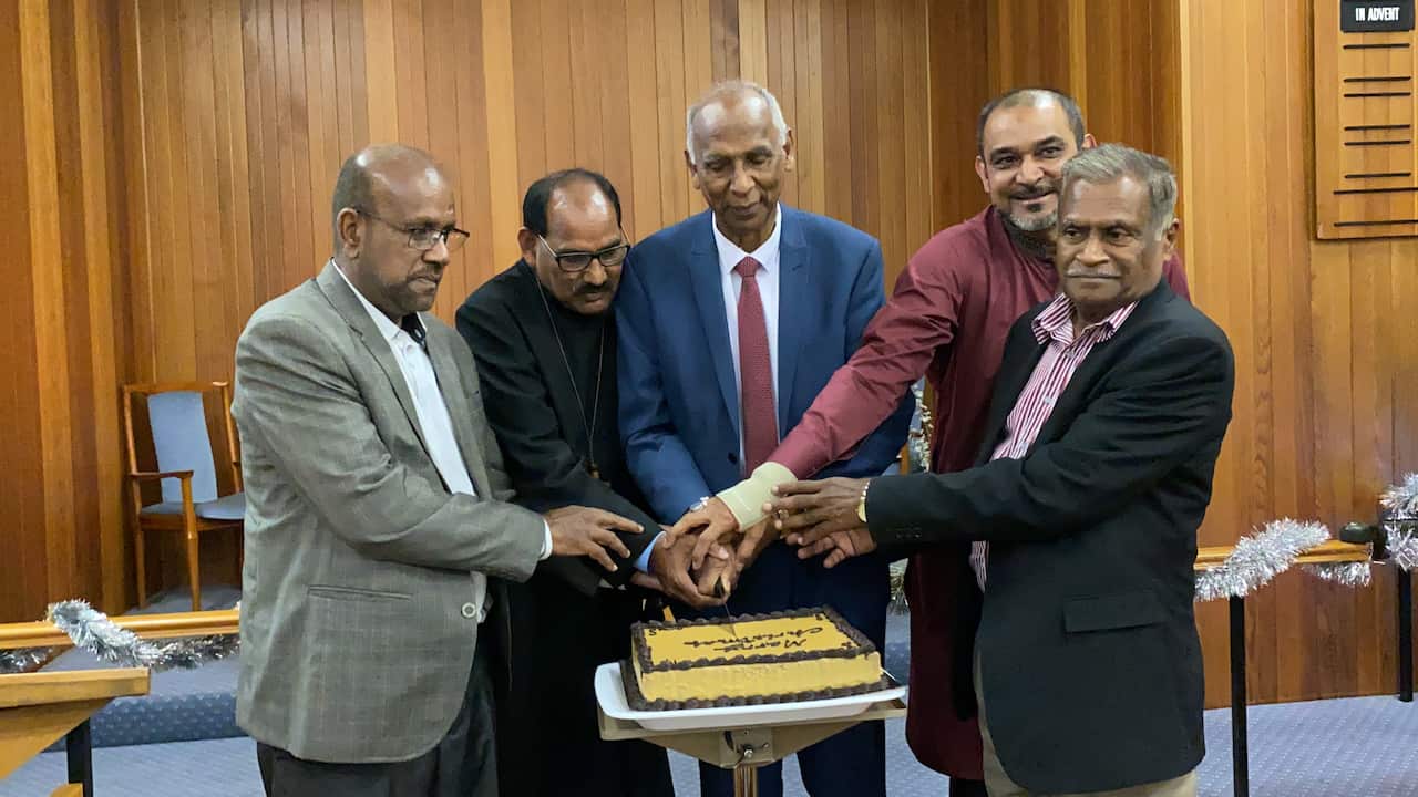 Christmas cake cutting ceremony