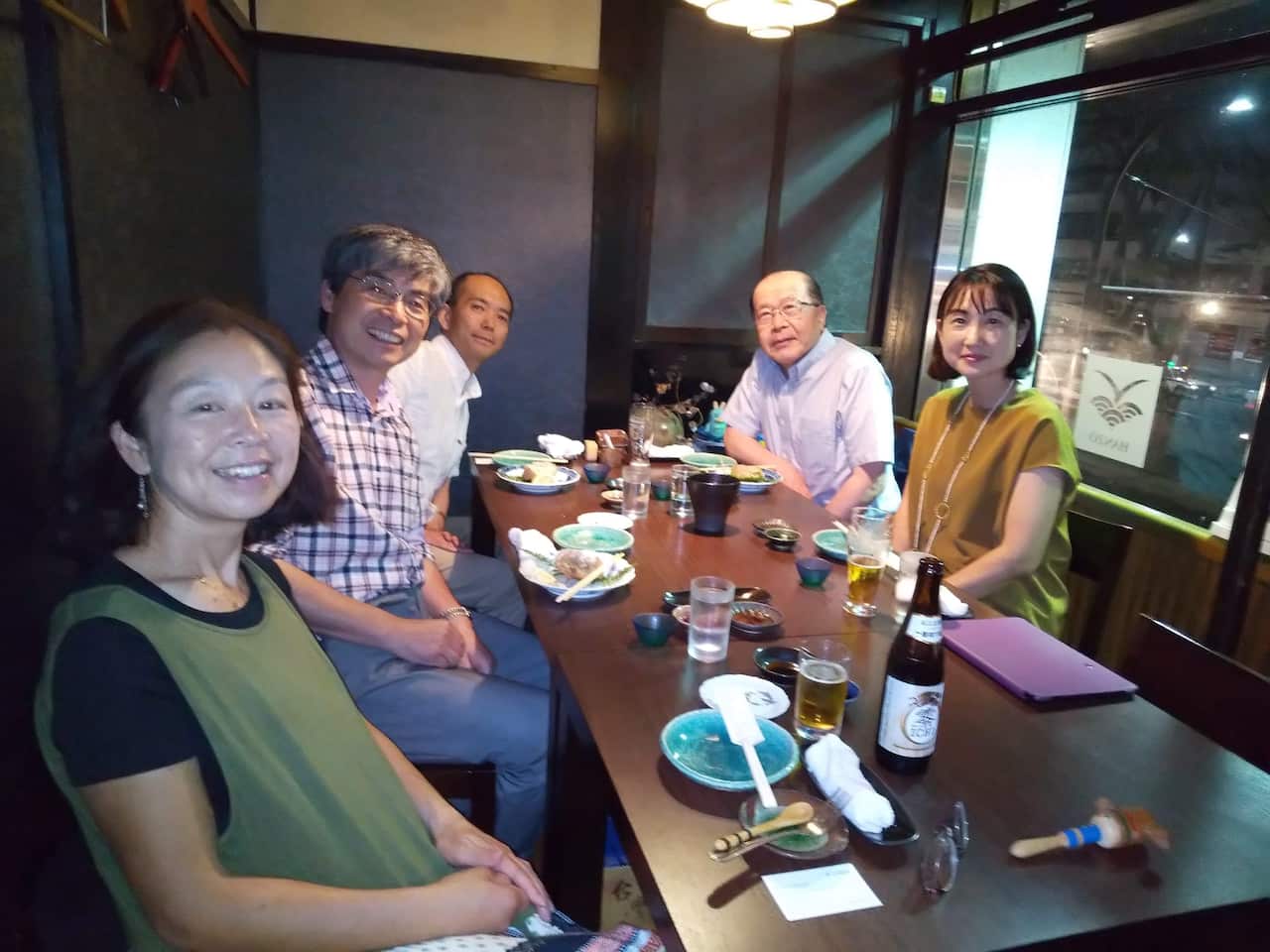 Dr. Hitomi Nakanishi (right) with a team who worked on an English book 'Surviving the 2011 Tsunami' which is published in 2014. 