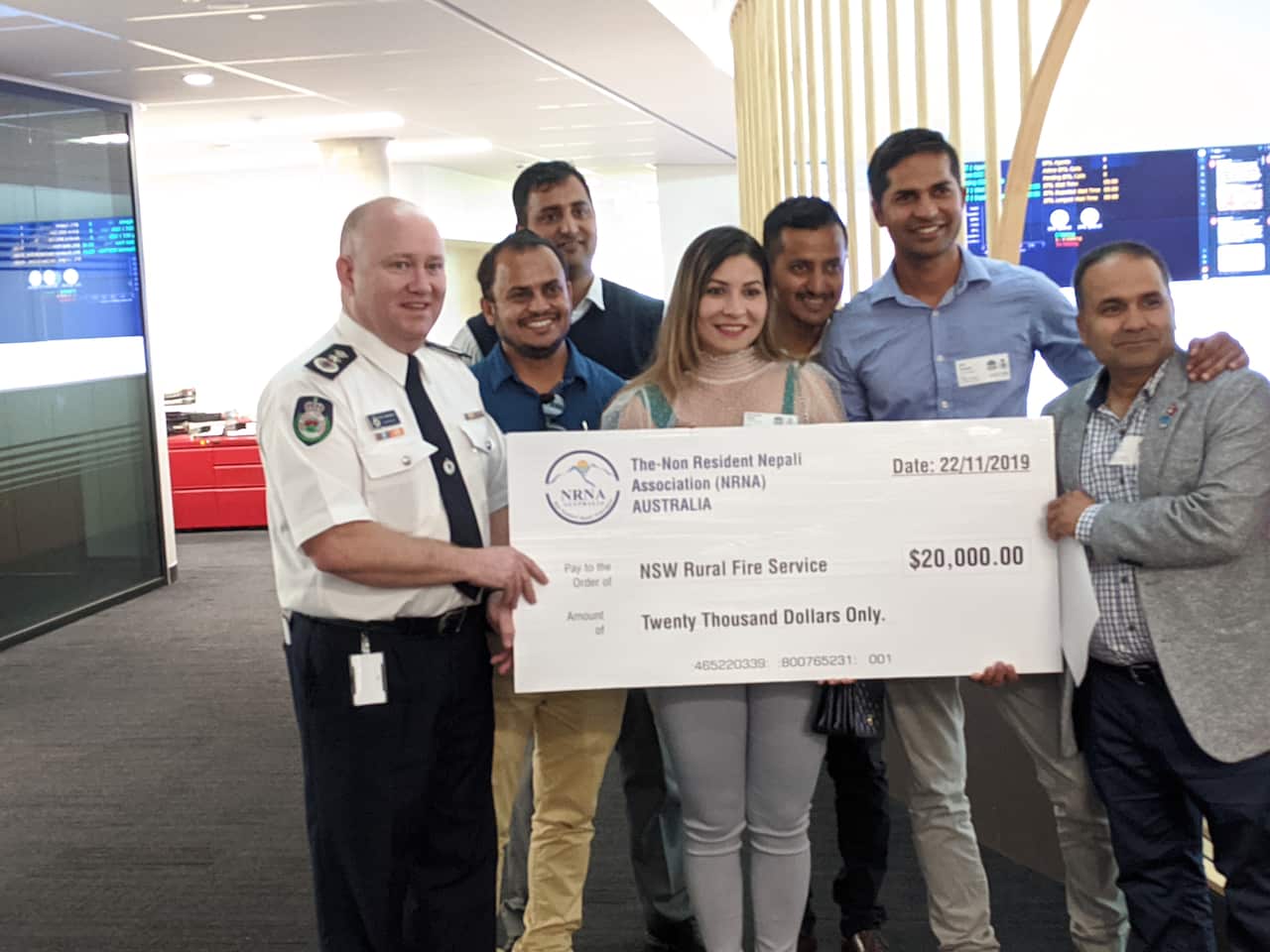 Members of Australia's Nepali community with NSW Rural Fire Service Commissioner Shane Fitzsimmons in Sydney.