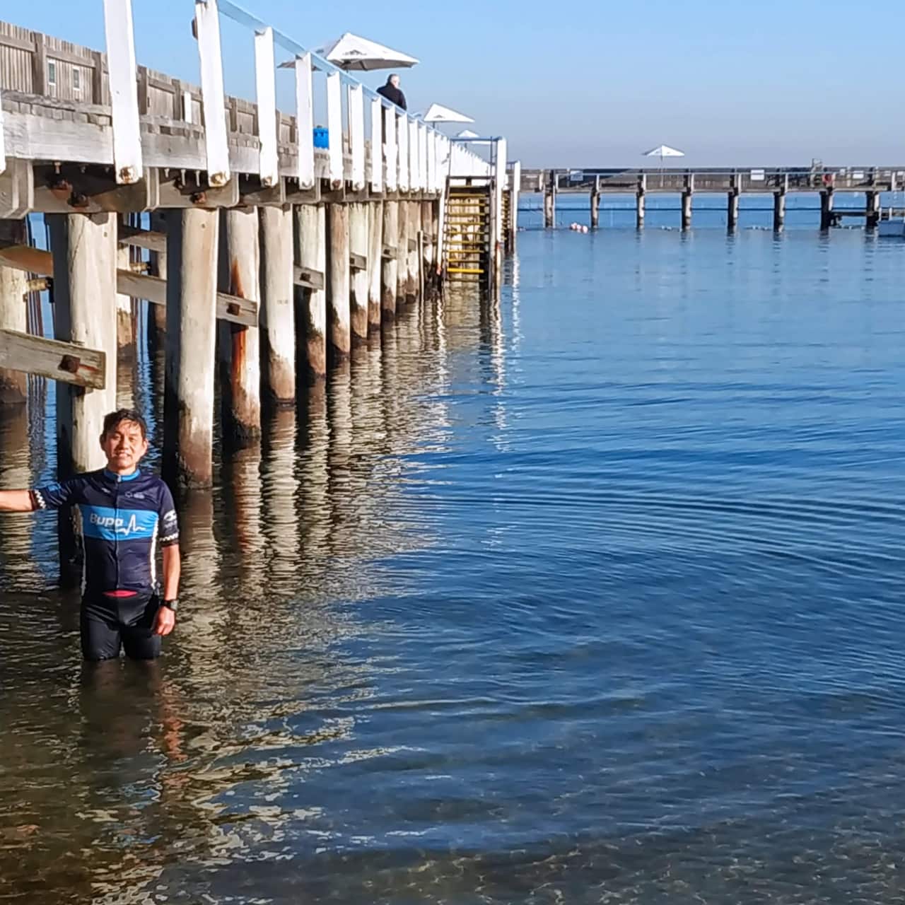 Sujun Jiao standing in Brighton Bath's enclosed sea baths. 