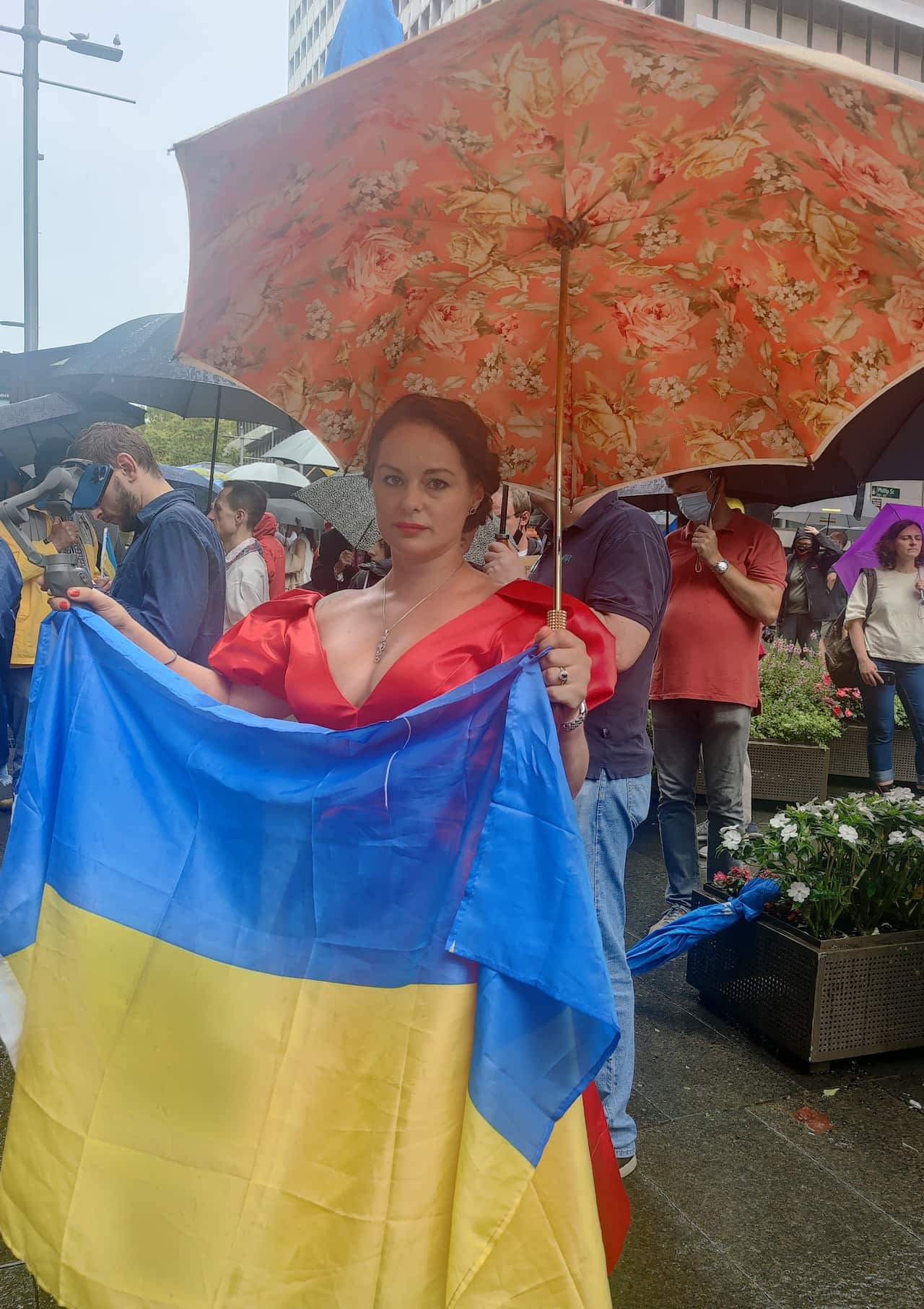 Alevtina, a Russian-Australian resident attended a Sydney protest in her evening dress.
