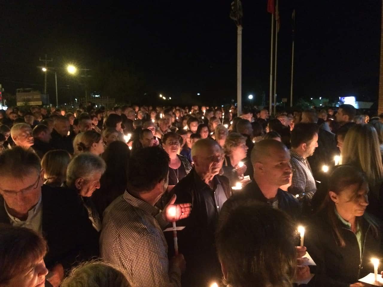 Believers in front of the church