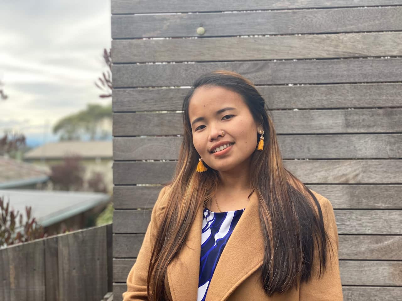 Twenty-three year old Pabitra Subba smiling at the camera.