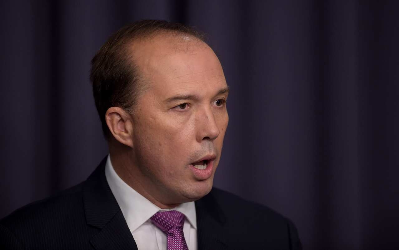 Australian Immigration Minister Peter Dutton speaks to the media during a press conference at Parliament House in Canberra, Thursday, March 17, 2016. (AAP Image/Lukas Coch) NO ARCHIVING