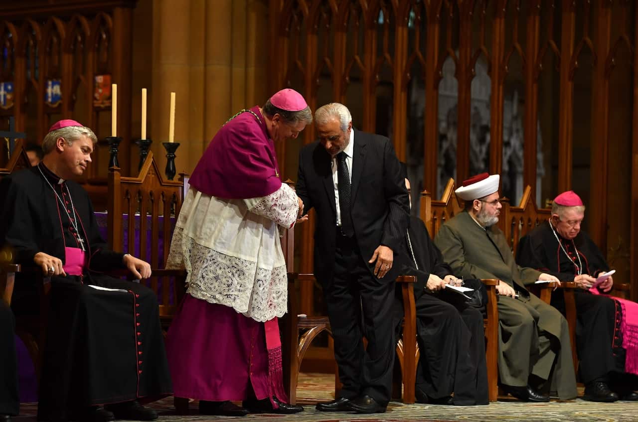 Archbishop of Sydney Anthony Fisher (left) speaks with Grand Mufti of Australia Ibrahim Abu Mohamed after he addressed an Interfaith gathering on Sunday.